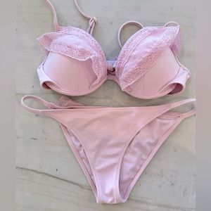 Victoria’s Secret two-piece pink bikini with crocheted eyelet ruffle